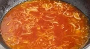Add water, tomato paste, sugar and a little salt. Bring to a boil, pour sour cream mixed with flour. Stir and bring to a boil again.