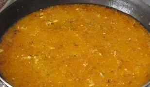 Pour a glass of water into the pan, add sour cream, a teaspoon of salt and all the remaining spices, mix well and bring to a boil, then t...