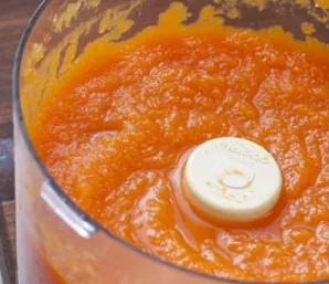 Now you need to drain all the water from the pumpkin. Transfer the pumpkin to a blender and crush.