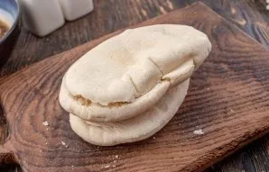 Cut the pita in half so that the 