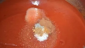 Add all the spices to the pan and salt its contents.