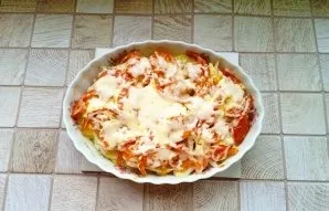 When the dish is ready, pull it out of the oven and sprinkle with grated cheese. Return to the hot oven for a few minutes until the chees...
