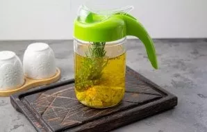 Pour the cooled oil along with lemon, garlic and rosemary. Put in a dark place for 3 days to stand up. After the time has elapsed, you ca...