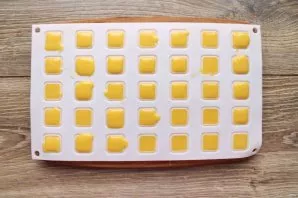 Cool the mass to a warm state and pour it into a candy mold.