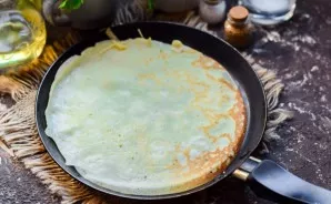 Heat the pan, then grease with oil and pour dough into the scoop. Bake pancakes on both sides after 30-40 seconds. Serve ready-made panca...