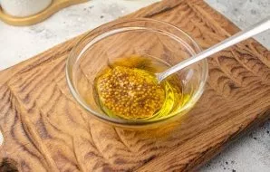 Mix olive oil with mustard, salt and pepper.