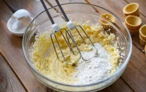 Add the wheat flour to the resulting mass and start the blender again to get a homogeneous cream - this is frangipane. Put the bowl with ...