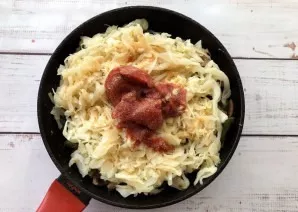 Add tomato paste, salt, pepper, mix everything thoroughly and simmer vegetables for 15-20 minutes over medium heat.