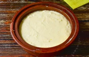 Stir and pour the dough over the apples.