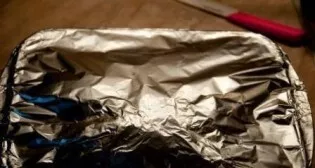 Sprinkle the chicken with oil, cover with foil and place in the oven for an hour to bake at a temperature of 200 degrees.