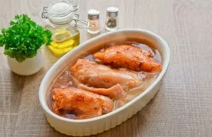 Pour rice and chicken with hot water. Cover with foil and place in the oven. Fry rice with chicken for 60 minutes. Then carefully remove ...