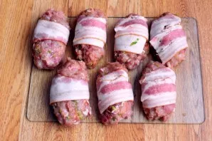 Wrap each cutlet with bacon.