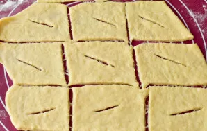 Cut out the rectangles and make notches in the center.