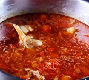 After an hour, put a head of garlic in a saucepan (it can be whole, you can use separate cloves), bring the soup to a boil and put fried ...