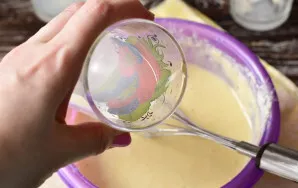 Pour boiling water into the dough. Mix very well.