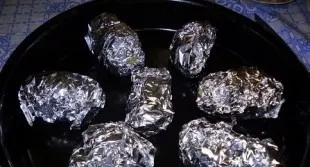 Put the potatoes on a baking sheet, bake in an oven at 180 degrees for 50 minutes.