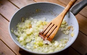 Prepare the sauce. Finely chop the onion and put in a pan with vegetable oil. Cook over medium heat until gently golden, stirring constan...