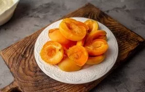 Wash apricots, dry. Divide in half and remove the bone.