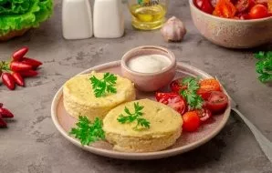 After the signal, carefully remove the molds and let them cool slightly. Then carefully transfer to a plate and serve with fresh vegetabl...