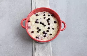 Place the dough in a lightly greased microwaveable bowl. Spread the remaining berries on top.