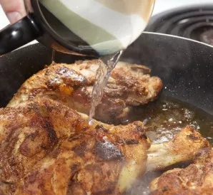 Now add 1 cup of water to the pan, lower the heat, cover and cook until the water evaporates completely. During this time, the chicken wi...