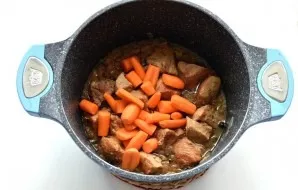 Add carrots and simmer for 10 minutes. Do not mix.