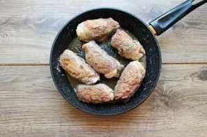 Fry the rolls on all sides until golden brown. It will take approximately 5-7 minutes.