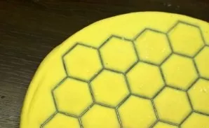 Then take a rolling pin and start gently rolling on top of the dough. Roll until the form appears. Prepare the dough remaining at the edg...