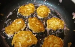 When the chicken saturates with the egg-cheese mixture, heat the vegetable oil in a pan and put it like pancakes with a spoon or scoop, p...