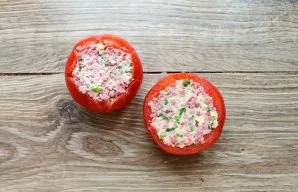 Stuff the tomatoes carefully with the filling and place in the refrigerator for 3-4 hours. Cut the tomatoes into medallions and serve.