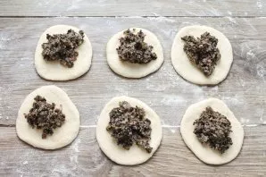 Roll out each ball and lay out the filling.