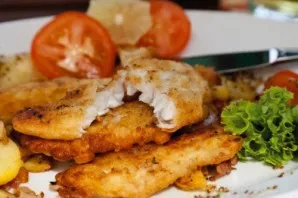 Put the fish on a plate, decorate with herbs and vegetables, and a delicious dinner for the whole family is already ready!