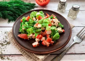 The salad with crab sticks and cheese is ready. Delicious!