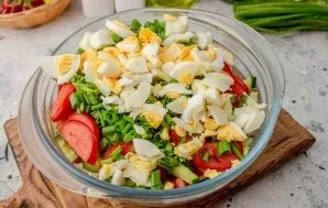 Peel the boiled eggs and cut into small cubes, put in a salad.