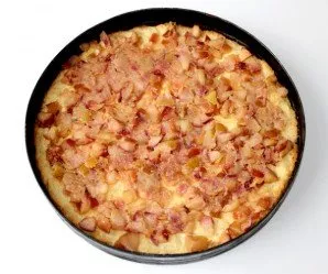 First, bake the crust for 15 minutes until lightly browned. Then lay out the apples.