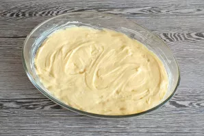 Put the dough on top of the bananas. It is better to do it with a spoon. Place the mold with the future cake in the oven, heated to 180 d...