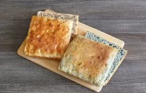 After the time has elapsed, cut each patty in half into two parts.