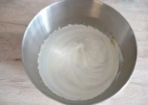 Beat the egg whites into a soft foam. Pour 150 grams of sugar, continue beating until stiff foam, then pour apple sauce and whisk into a ...