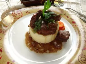 Serve the prepared beef with mashed potatoes.