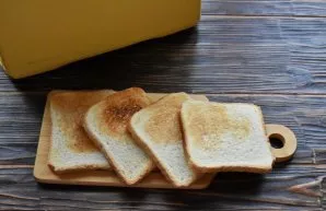 Toast the bread in the oven or use a toaster.