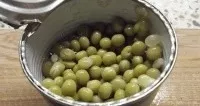 Open the jar of peas. Drain the liquid.