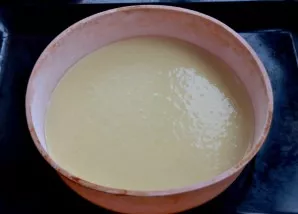 The scones of this cake are baked separately. Pour a third of the dough into the baking form, shake the container well to even it out, ba...