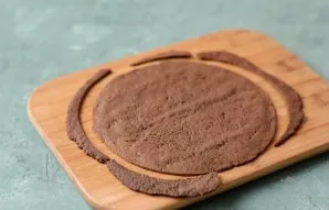 Cut each cake, before it cools down, to the desired diameter.