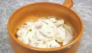 Salt, sprinkle with spices, grease with sour cream.