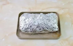 Wrap tightly in foil and put in the refrigerator for 12 hours so that the roll marinates.
