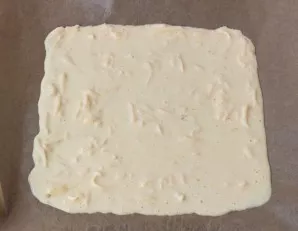 Cover the baking tray with baking paper (you can apply a little vegetable oil) and gently pour the omelet mass, forming a square with a s...