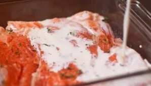 Pour cream sauce over the fish and sprinkle with cheese.