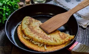 Fold the pancake in half.