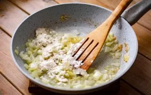 Add 2 teaspoons of flour to the onion and, stirring intensively with a spatula, continue to fry everything together for another couple of...