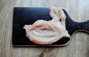 Wash the chicken breast and dry it with a paper towel. Turn the tenderloin to the side and make a small cut. Make a cut in the middle wit...
